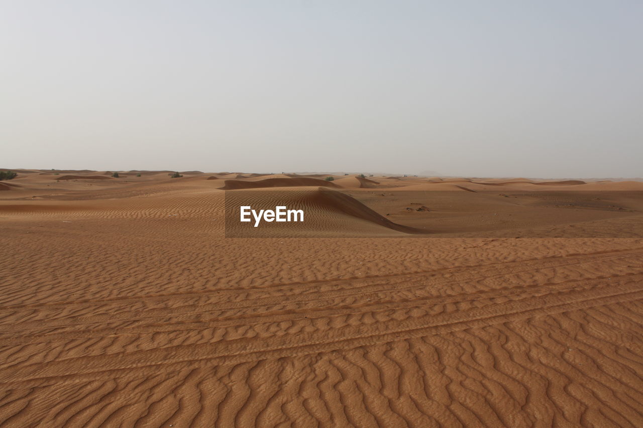 Scenic view of desert against clear sky