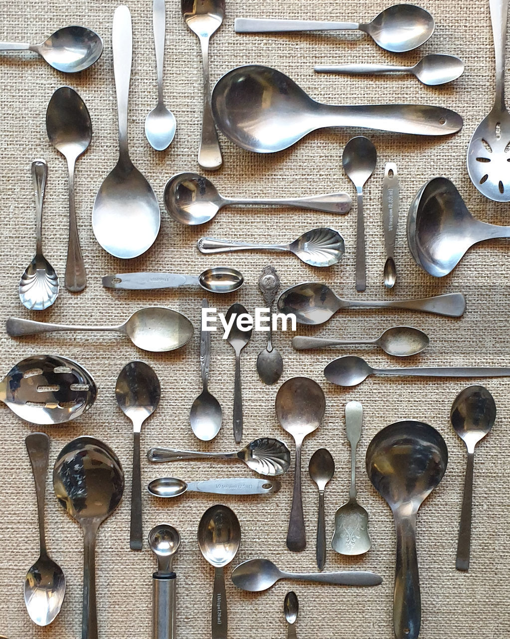 High angle view of kitchen cutlery flat lay on table 