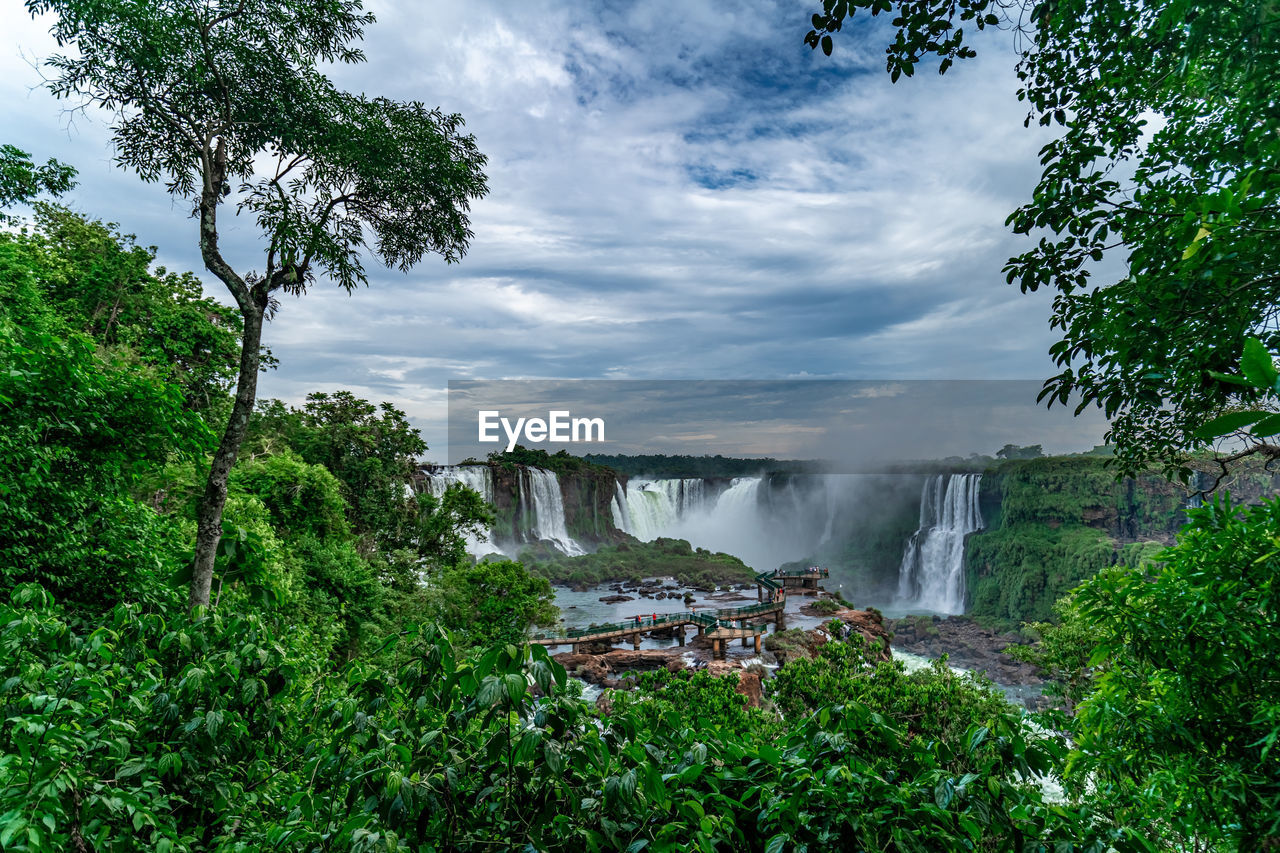 scenic view of waterfall against sky