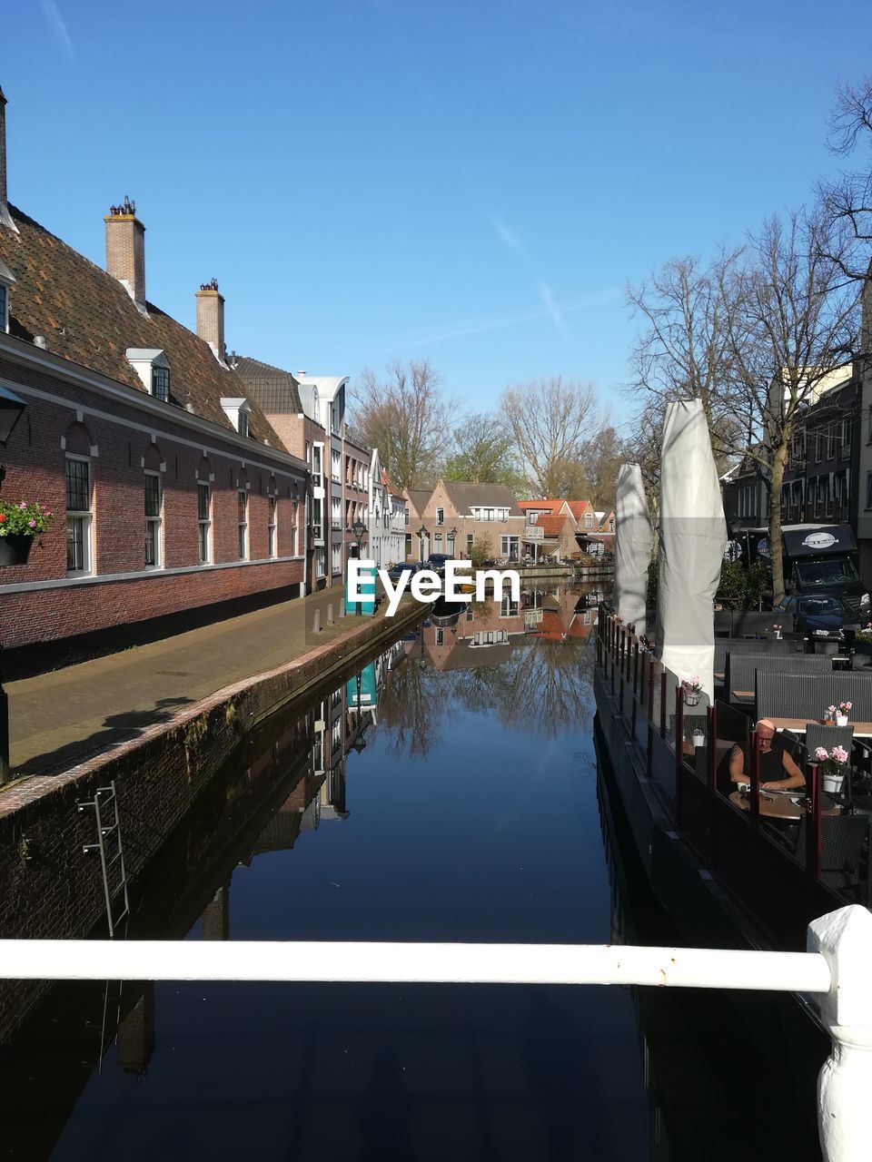 CANAL AMIDST BUILDINGS IN CITY