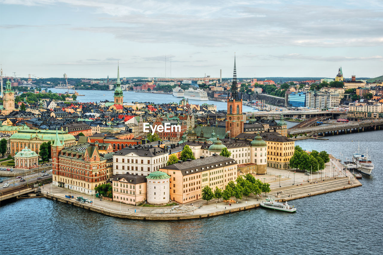 High angle view of river against buildings in city