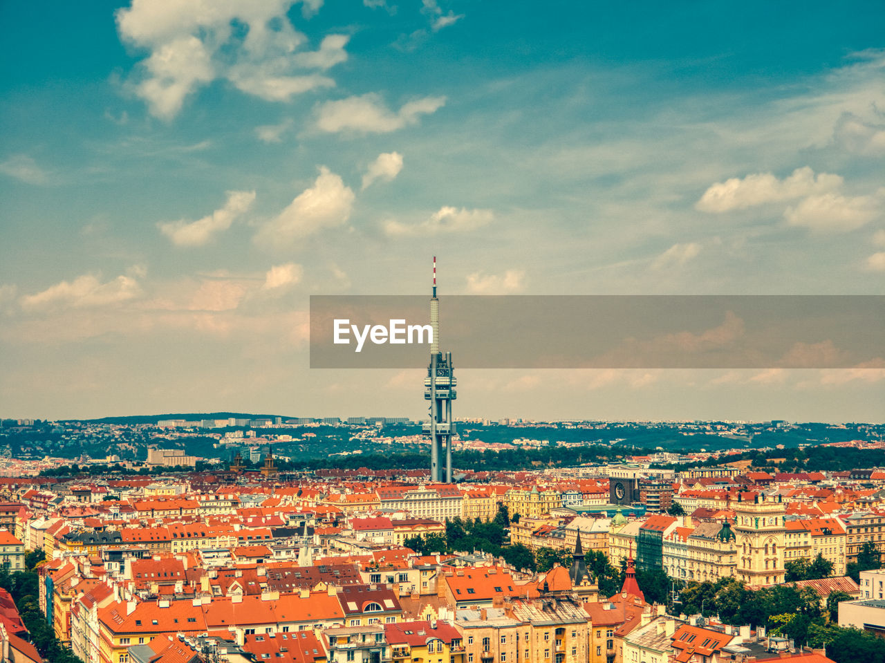 Aerial view of tv tower in prague zizkov under hot summer and clouds