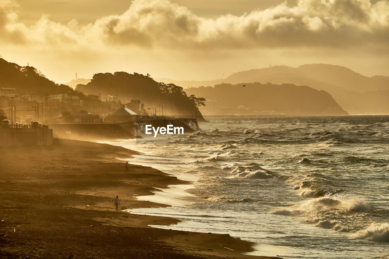 Scenic view of sea against sky during sunrise 