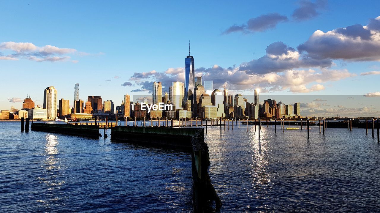 Panoramic view of river and buildings against sky