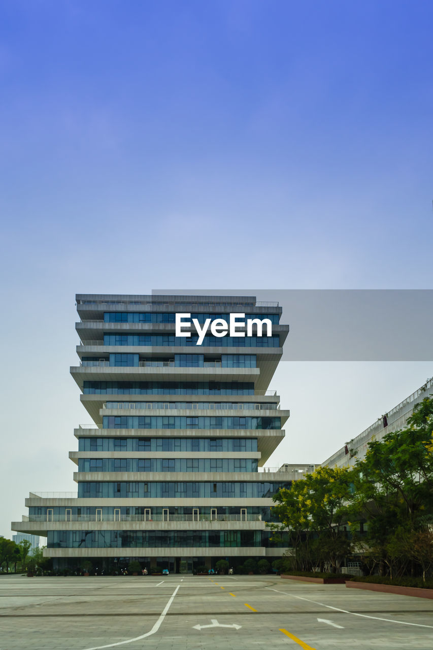 Low angle view of building against blue sky