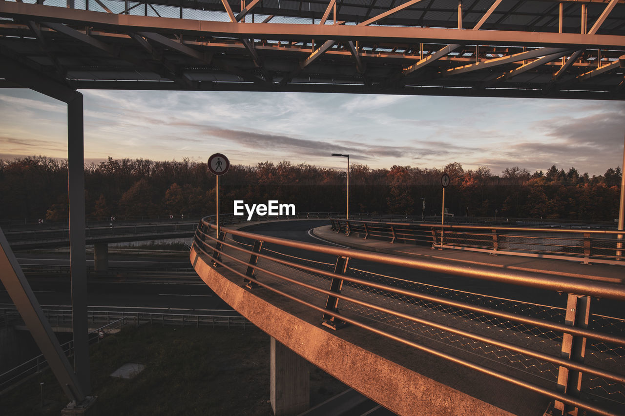 Empty railroad station platform against sky