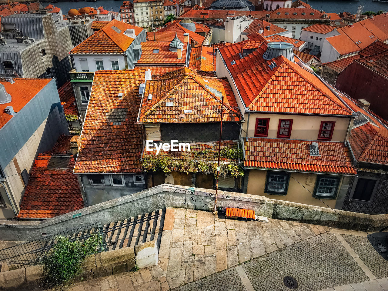 View from a high angle of the yellow roofs of houses in the city