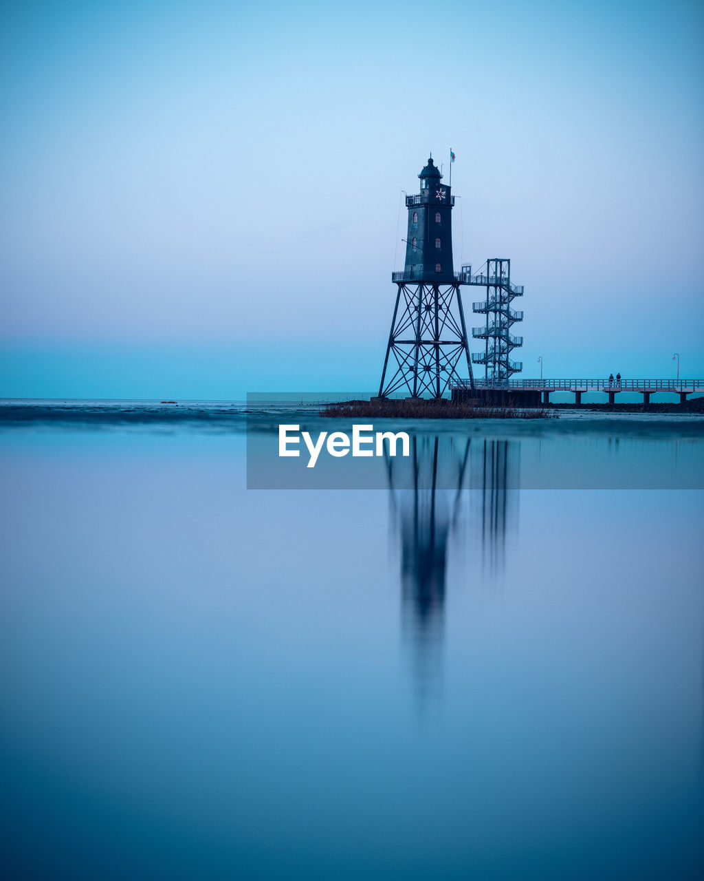 Lighthouse of obereversand with blue evening sky after sunset.
