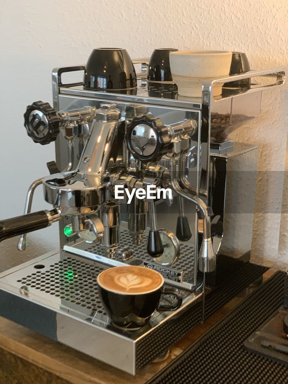 CLOSE-UP OF COFFEE CUPS IN KITCHEN