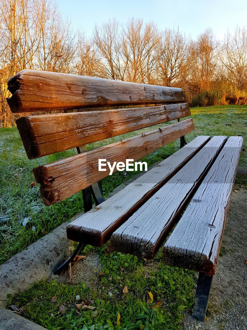 WOODEN STRUCTURE ON FIELD AGAINST SKY