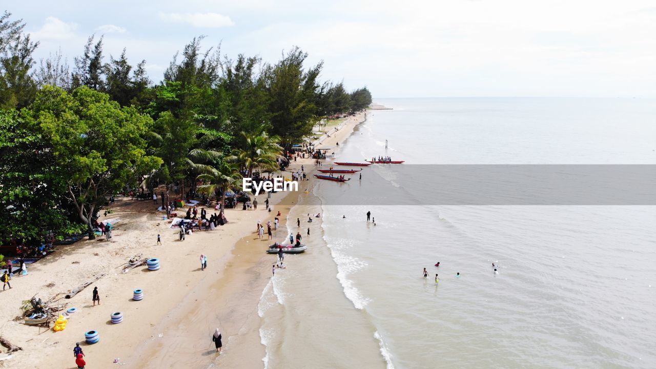 HIGH ANGLE VIEW OF PEOPLE AT BEACH