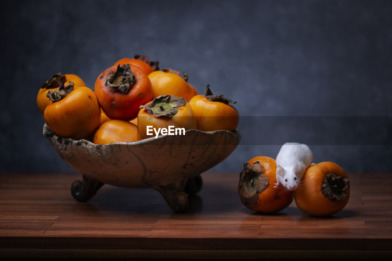 High angle view of fruits on table with a mouse