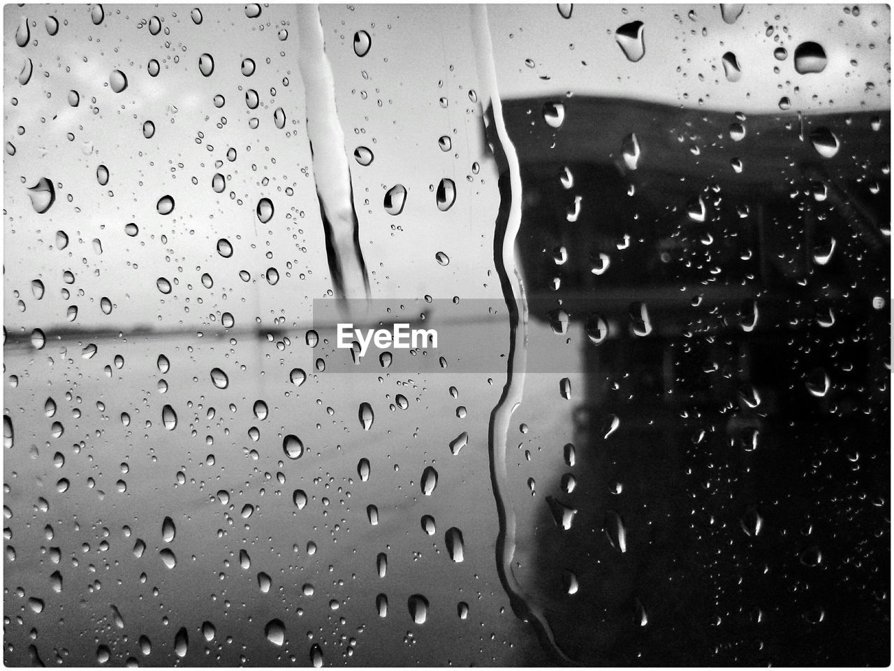 Full frame shot of wet window in rainy season