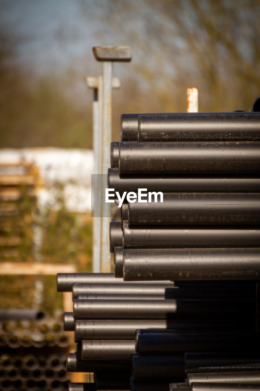 Stack of pipes against a soft background