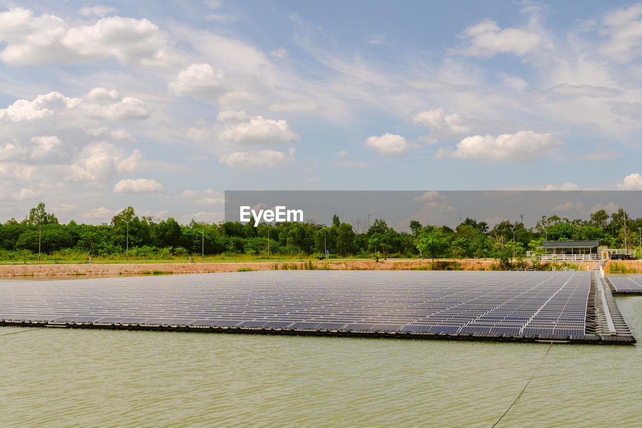 Solar panels are installed around the pool against. solar panels for natural power generation.