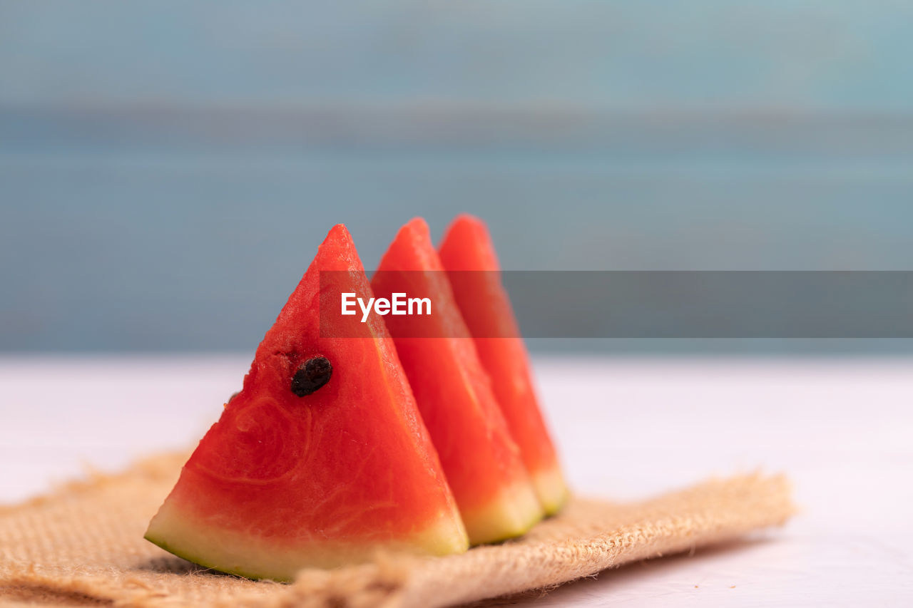 Watermelon slices on the wooden table.