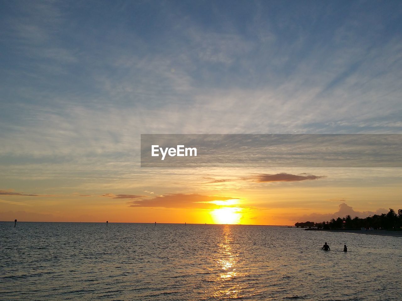 SUNSET OVER CALM SEA