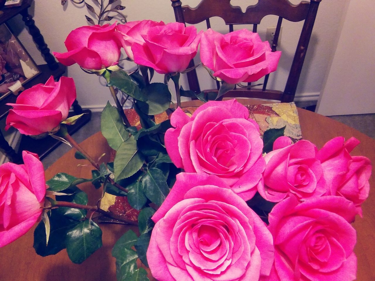 CLOSE-UP OF PINK ROSES IN VASE