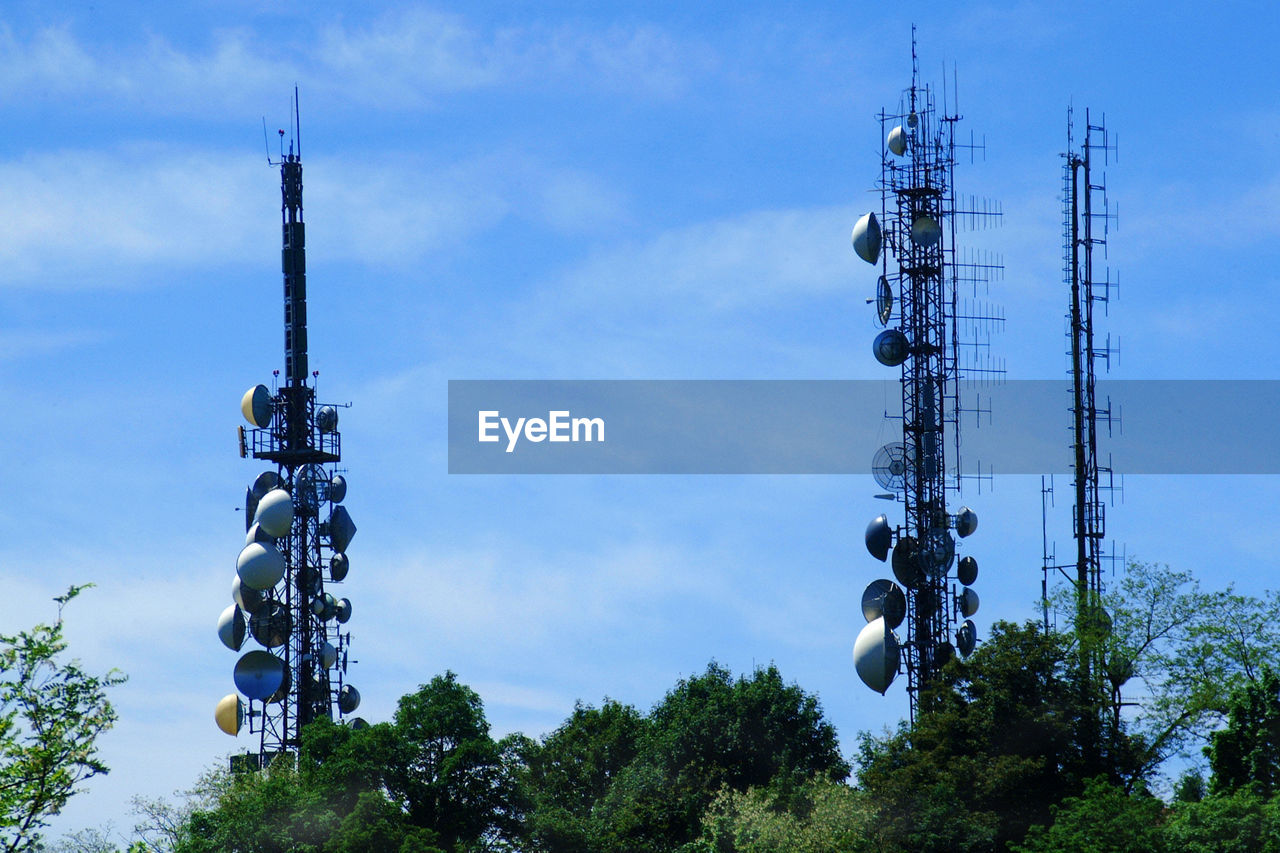 Low angle view of communications tower against sky