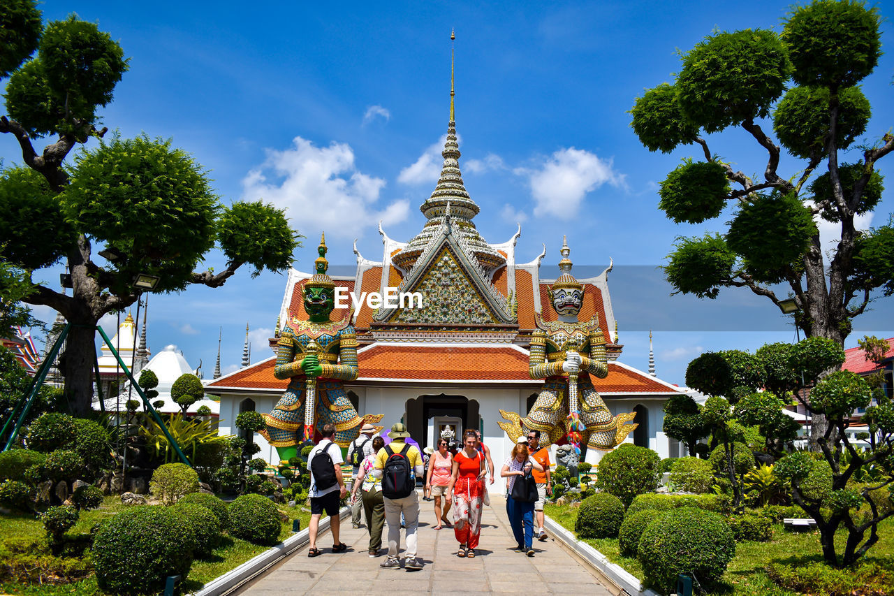 PEOPLE AT TEMPLE OUTSIDE BUILDING