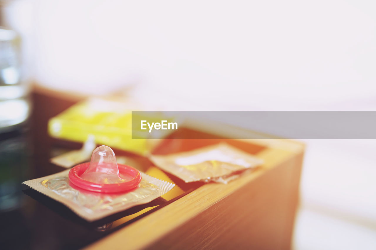 Close-up of condom on table