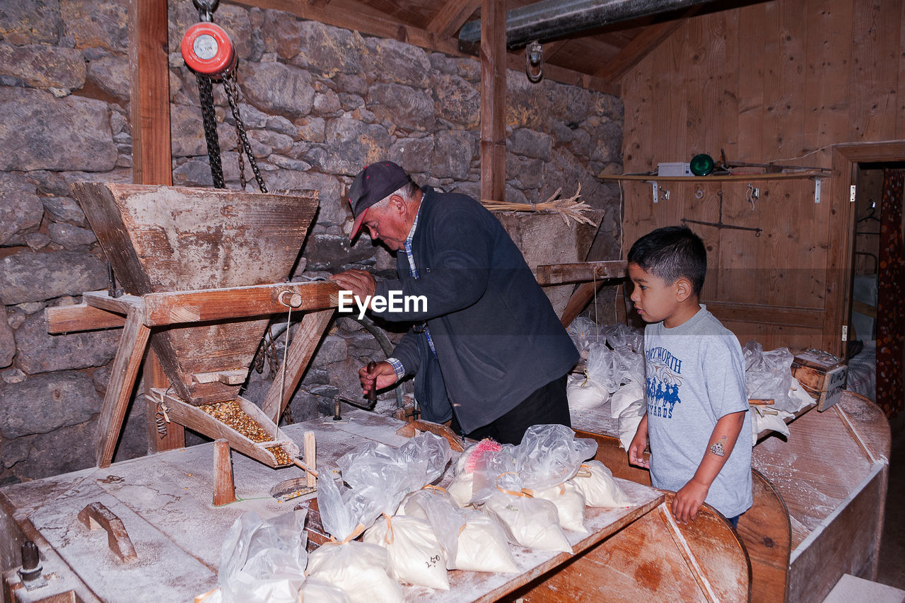 Man and boy at flour mill