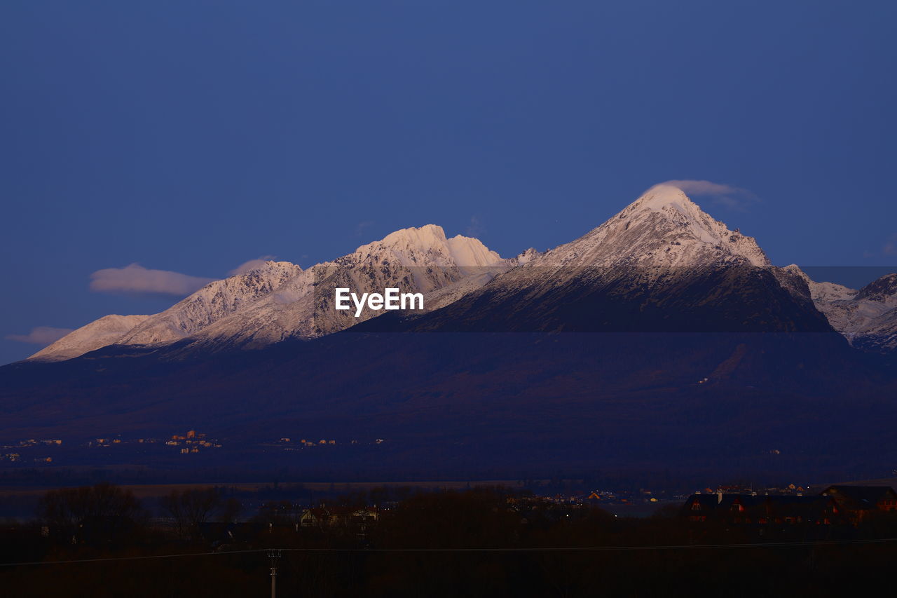 SCENIC VIEW OF MOUNTAINS AGAINST BLUE SKY