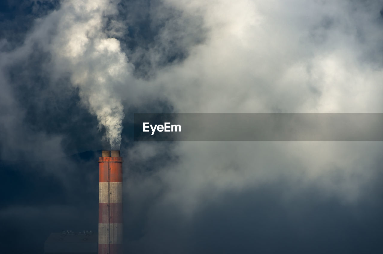 Smoke, steam on the chimney of coal power plant, air pollution, steam power plant. blow-off.