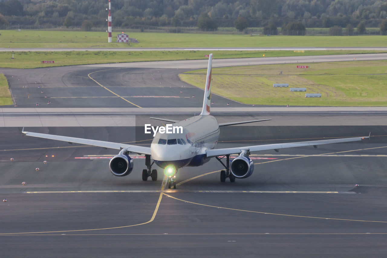 AIRPLANE ON RUNWAY AT AIRPORT