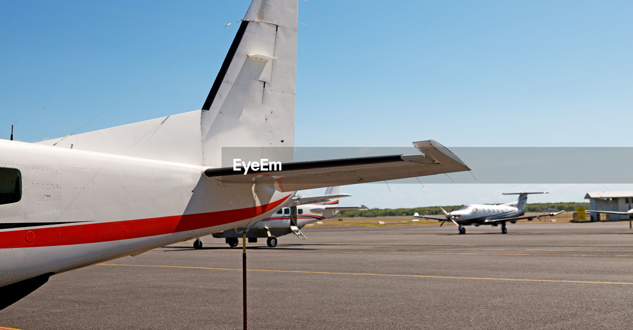 AIRPLANE ON RUNWAY AGAINST SKY