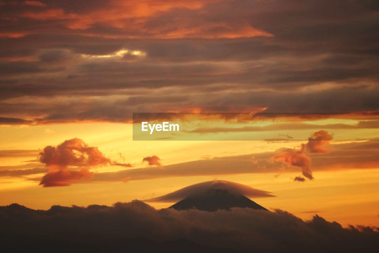 Scenic view of cloudy sky at sunset