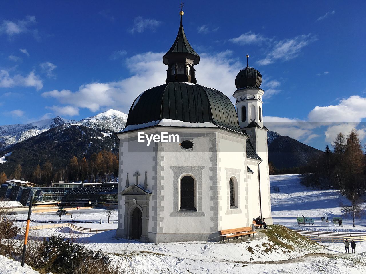 CHURCH BY BUILDING AGAINST SKY