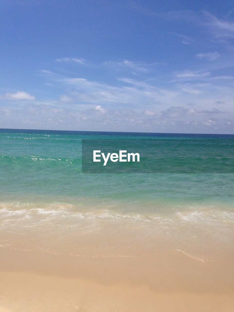 Scenic view of sea against blue sky