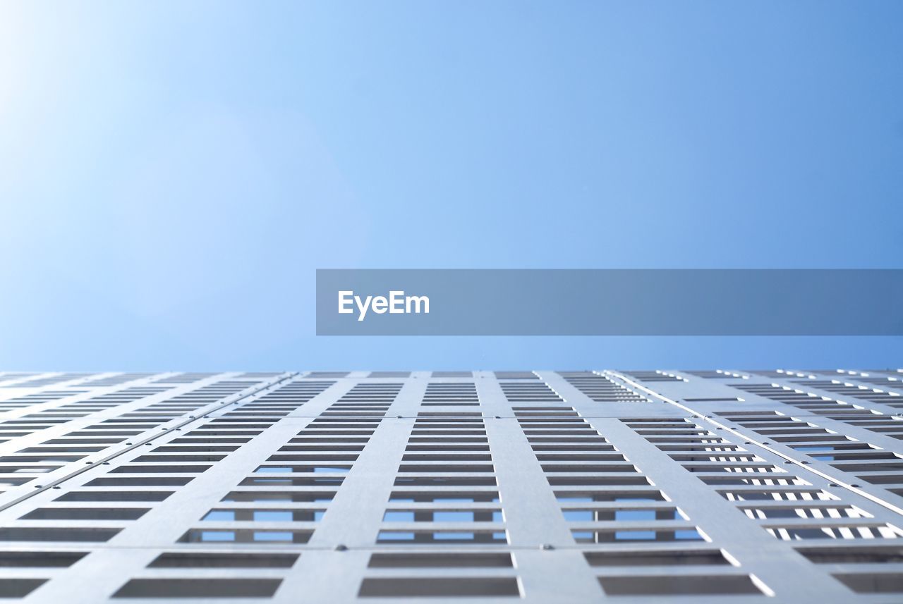 Low angle view of modern building against clear sky