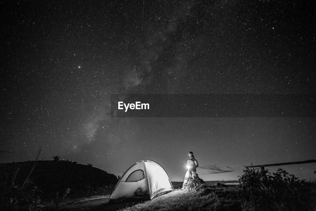 Low angle view of tent against sky at night