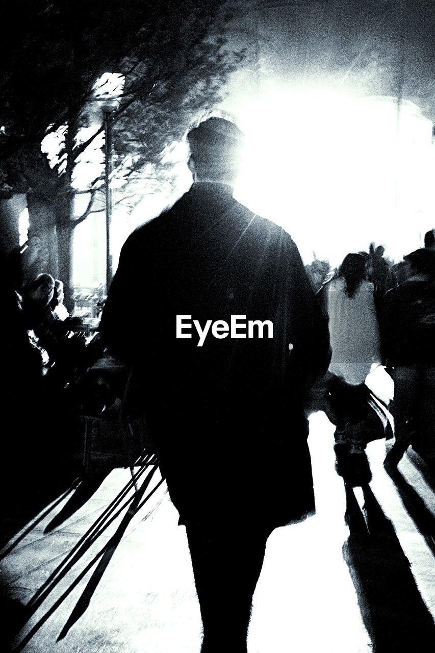 WOMAN STANDING IN POND