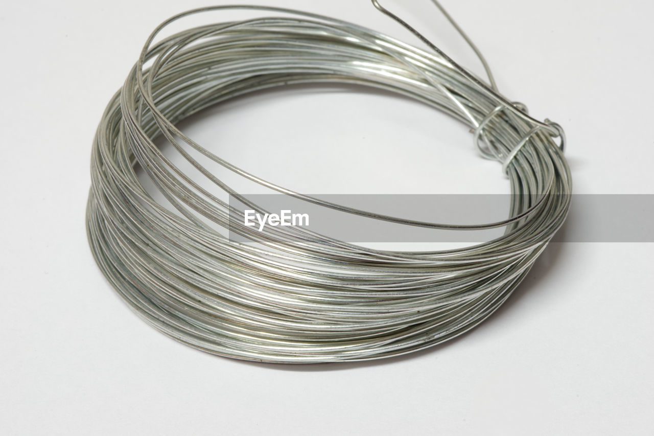 Metal wire rolled on white background