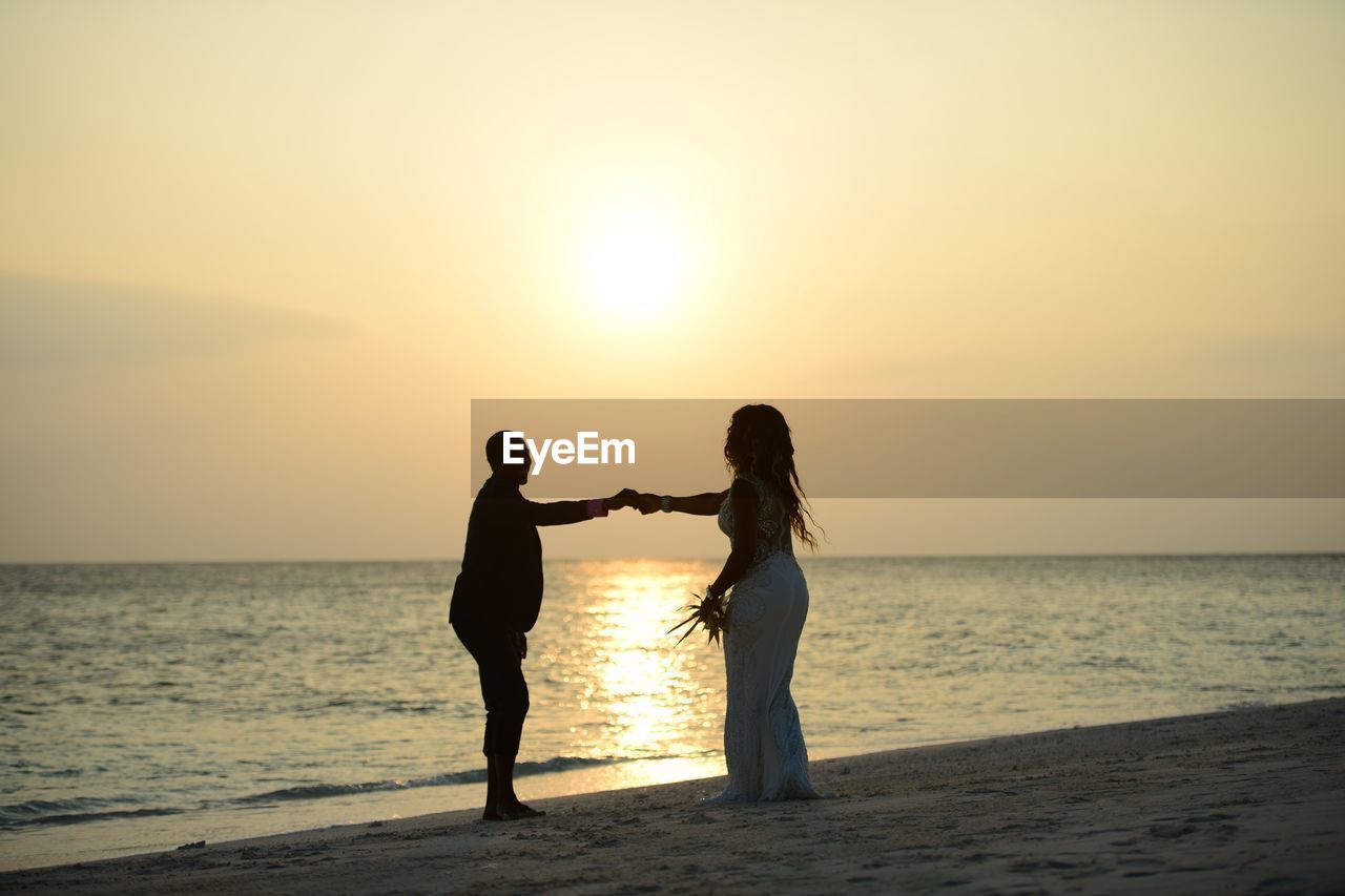 Silhouette of people on beach