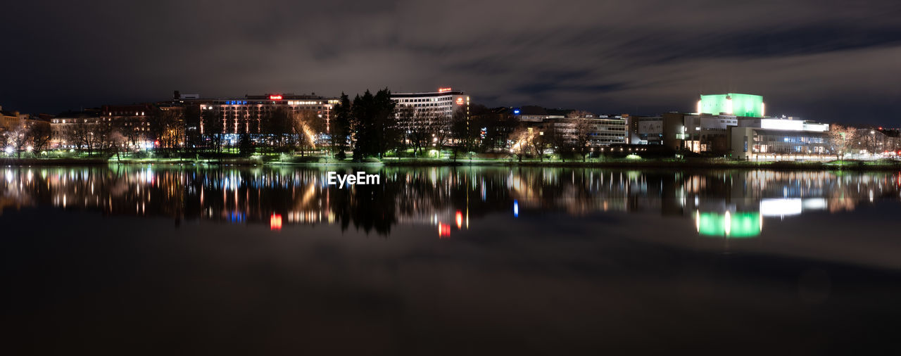 REFLECTION OF ILLUMINATED BUILDINGS IN WATER