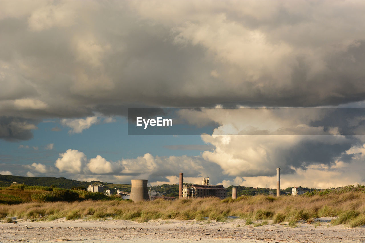 cloud, sky, environment, horizon, landscape, nature, rural area, land, architecture, no people, built structure, field, sea, plain, prairie, outdoors, scenics - nature, beauty in nature, day, wind, storm, morning, power generation, dramatic sky, environmental conservation, plant, grass, cloudscape, coast, hill, travel, social issues, building exterior