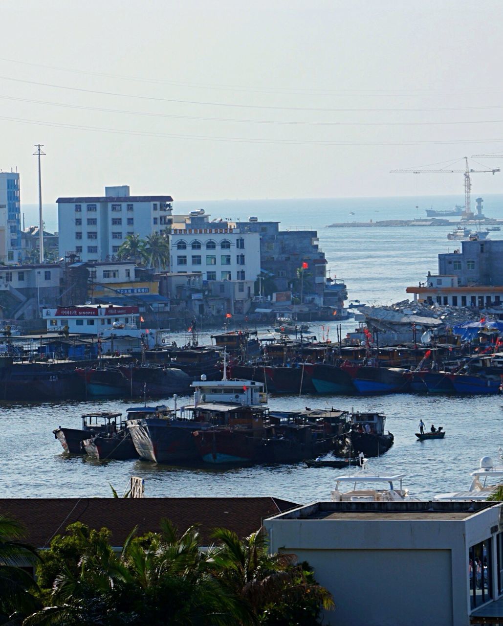 BOATS MOORED IN HARBOR