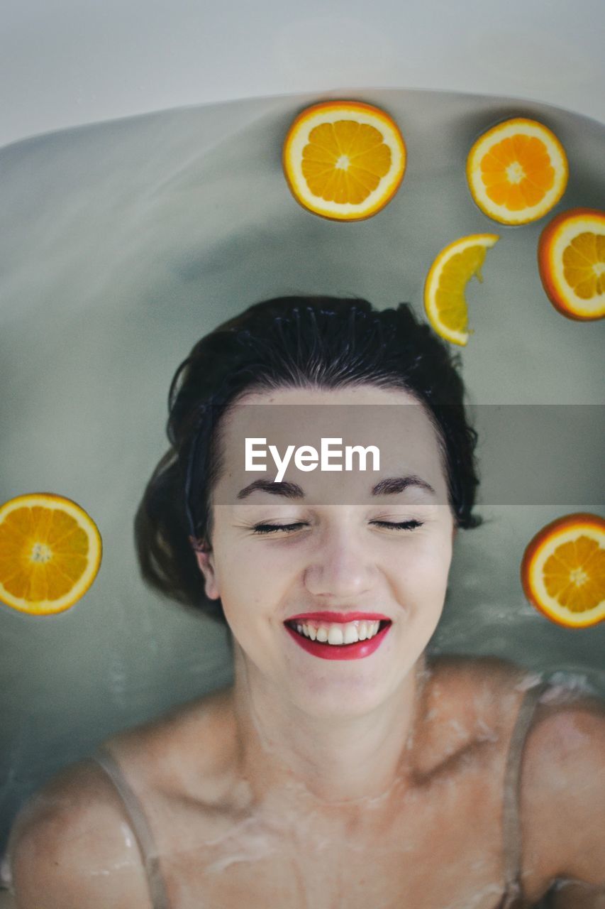 High angle view of woman in bathtub at home