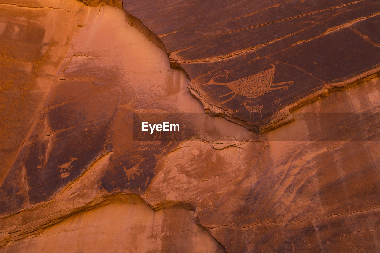 Bighorn sheep petroglyph on red rock in the monument valley navajo tribal park 