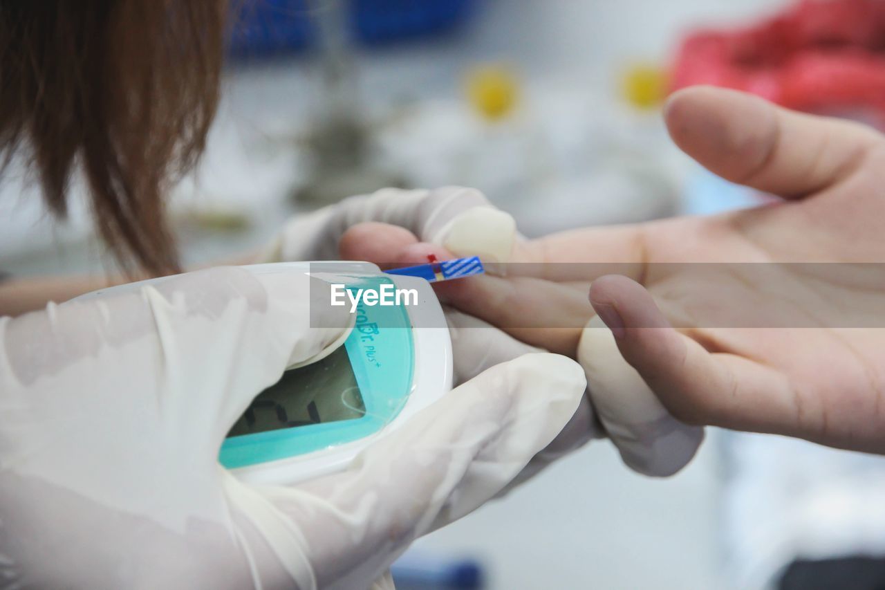 Doctor taking blood test of patient