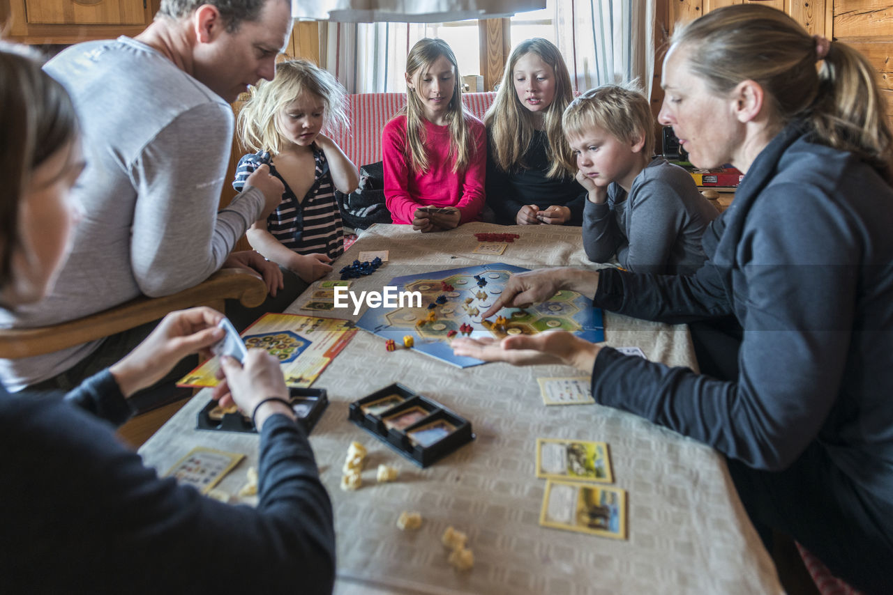 Family playing board game