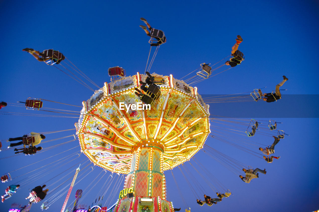 LOW ANGLE VIEW OF FERRIS WHEEL AGAINST SKY