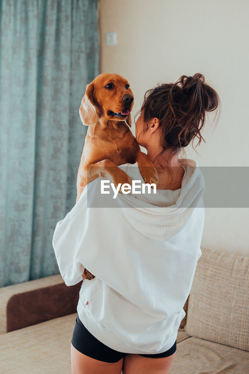 Woman with dog at home