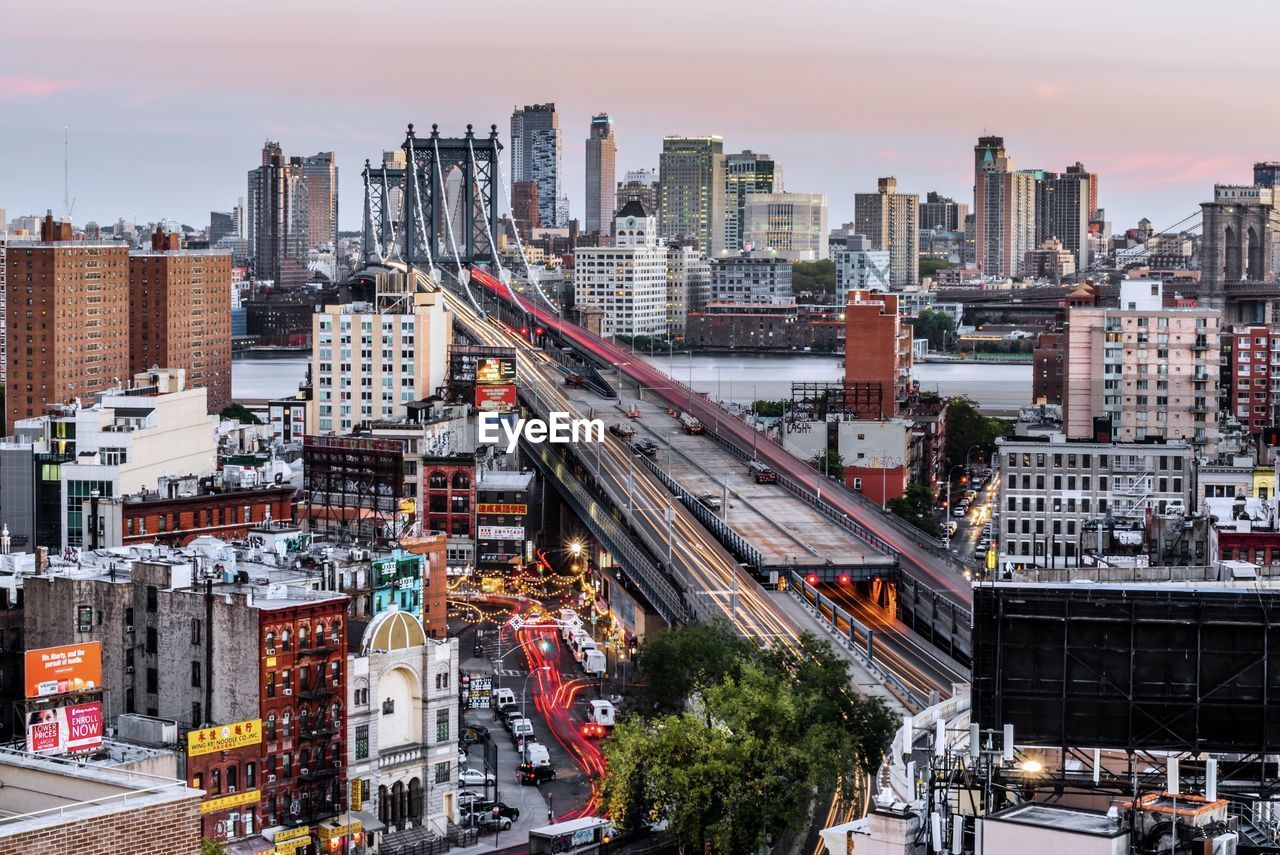 High angle view of street amidst buildings in city against sky