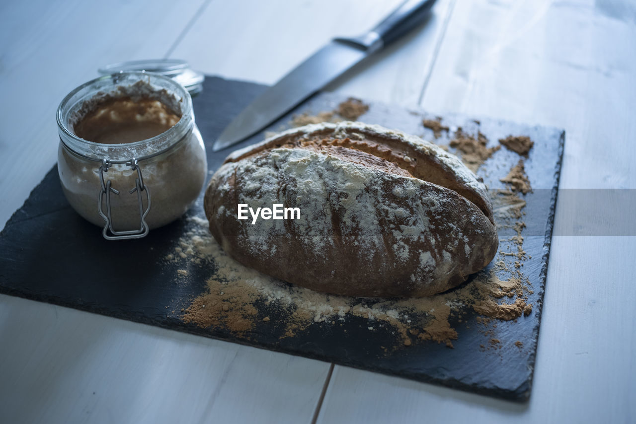 High angle view of homemade rustic bread on table.