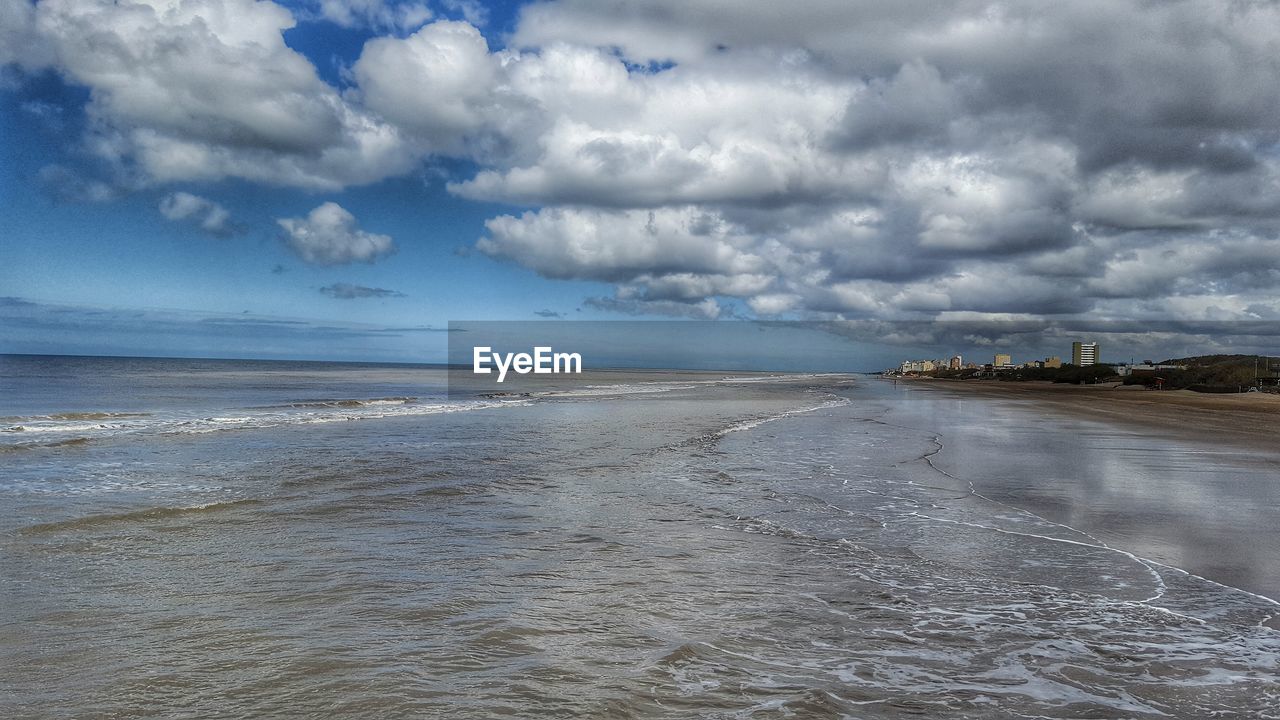 VIEW OF SEA AGAINST CLOUDY SKY